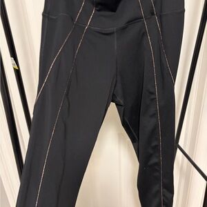 Nike Black Yoga Leggings with Gold Stitching